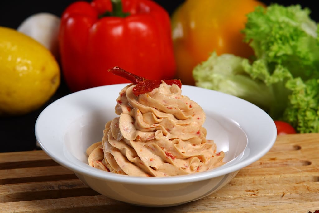 Delicious creamy hummus served with vibrant fresh vegetables for a perfect appetizer.